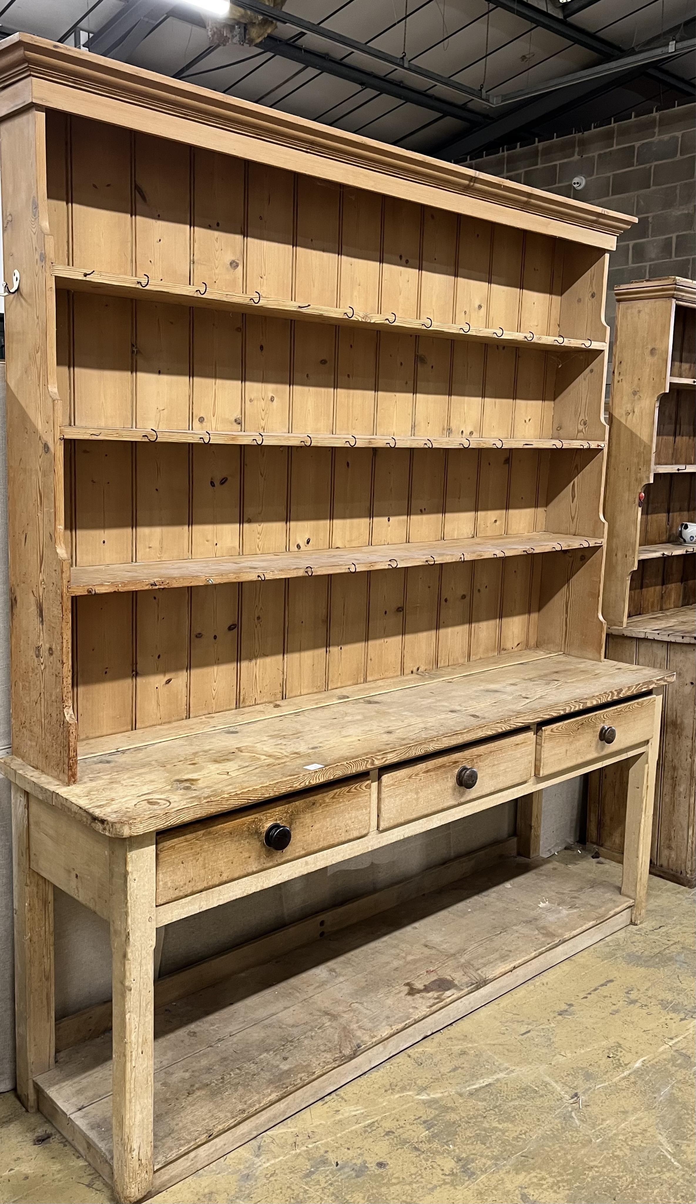 A Victorian pine potboard dresser with boarded rack, width 214cm, depth 55cm, height 88cm. Condition - fair